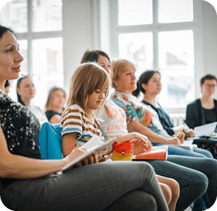 Parents and children attending a group session together